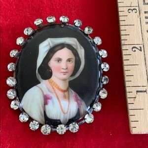 Stunning brooch, hand painted porcelain portrait.